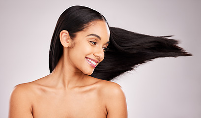 Image showing Beauty, hairstyle and wind with woman in studio for shampoo, confidence and keratin treatment. Textures, salon and shine with female model on white background for glow, self care and cosmetics