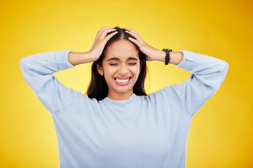 Image showing Young woman, stress and frustrated with headache, pain and distress isolated on yellow studio background. Female holding head, mental health and anxiety with depression, migraine and trauma