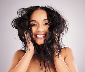 Image showing Hair care, woman is happy and beauty with portrait, cosmetics and messy hairstyle on studio background. Wellness, shine and female smile, face and cosmetic treatment, keratin and texture with volume