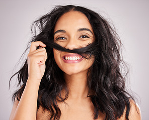 Image showing Hair, happy woman and beauty with portrait, playful with cosmetics and messy hairstyle on studio background. Wellness, shine and female smile, face and treatment, keratin and texture with volume