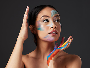 Image showing Beauty, art and woman with paint on face and hands, creative makeup and self expression. Aesthetic, creativity and artistic color cosmetics, skincare and freedom to express for young beautiful girl.