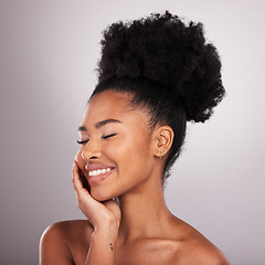 Image showing Skincare, smile and black woman with eyes closed in confidence, white background and cosmetics. Health, dermatology and natural makeup and African model in studio for healthy skin and wellness.