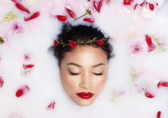 Image showing Beauty, milk and flowers with woman in bath for spa treatment, relax and skincare. Wellness, cosmetics and pampering with female and rose petals from top view for grooming, satisfaction and self care