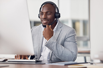 Image showing Black man, call center and computer with headset for telemarketing, customer service or support at office desk. Happy African American male consultant agent smiling with headphones on PC for advice