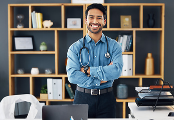 Image showing Portrait, healthcare and man with arms crossed, hospital and happiness with development, medicine and research. Face, medical professional and happy male employee with confidence, wellness or success