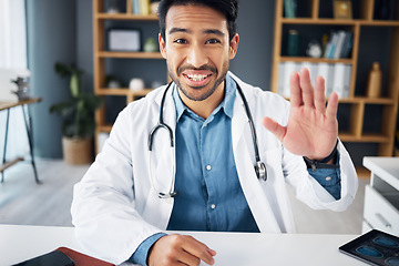 Image showing Portrait, doctor and man on video call, waving and greeting in workplace, diagnosis and discussion. Face, male employee and medical professional online conversation, webinar and support with cure