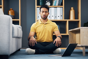 Image showing Meditation, laptop and a yoga man breathing for mental health, wellness or zen on the floor of his home. Fitness, internet and virtual class with a male yogi in the living room to meditate for peace