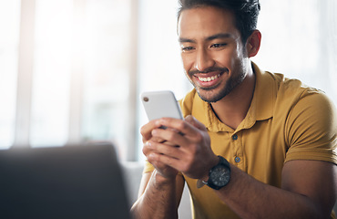 Image showing Happy asian man, phone and smile for social media, communication or networking at home. Male freelancer smiling on mobile smartphone app for chatting, texting or browsing on internet or research