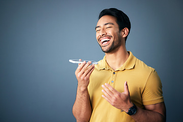 Image showing Mockup, phone call and Asian man with speaker, funny and guy laughing against a studio background. Japan, male and gentleman with cellphone, humor and conversation with joy, cheerful and connection