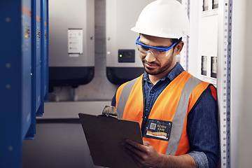 Image showing Man, electricity and technician in control room, writing notes and machine maintenance on clipboard. Male electrician, system and electrical substation for power, engineering inspection and checklist