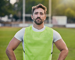 Image showing Rugby, game and portrait of man with confidence, serious expression and pride in winning game on field. Fitness, sports and face of player ready for match, workout or competition on grass at stadium.