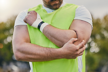 Image showing Rugby, pain and man with elbow injury on sports field after practice match, training and game outdoors. Medical emergency, accident and male athlete with joint inflammation, arm sprain and tendinitis