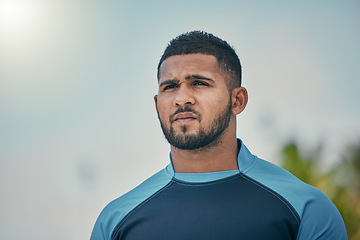 Image showing Sport, sky and man with serious expression, confidence and pride in winning game with focus. Fitness, sports and dedication, rugby player at match, workout or competition at stadium in New Zealand.