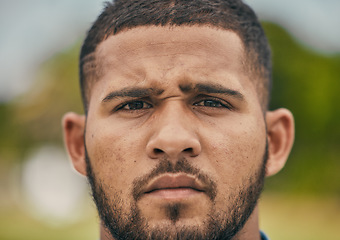 Image showing Rugby, focus and portrait of man with serious expression, confidence and pride in winning game. Fitness, sports and zoom on face of player ready for match, workout or competition on grass at stadium.