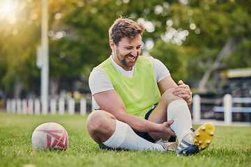 Image showing Football, man and knee pain on grass field, inflammation and bruise with training, workout and exercise. Male player, athlete or guy on ground, leg injury and health issue with practice and emergency