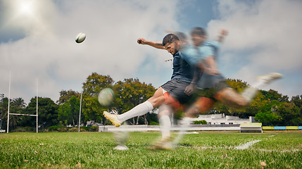 Image showing Rugby, blur and man kicking ball to score goal on field at game, match or practice workout. Sports, fitness and motion, player running to kick at poles on grass with energy and skill in team sport.