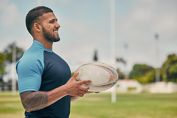 Image showing Rugby, field and happy man with ball, confidence and pride in winning competition game. Fitness, sports and happiness, professional player with smile, ready for match and workout on grass at stadium.