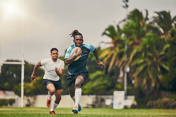 Image showing Rugby, chase and black man with ball running to score goal on field at game, match or practice workout. Sports, fitness and motion, player in action and blur on grass with energy and skill in sport.