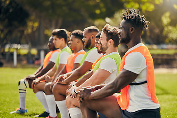 Image showing Rugby sport, diversity and men training outdoor on a grass field with a team on knee. Athlete group together for fitness, exercise and workout for professional sports club and strong teamwork