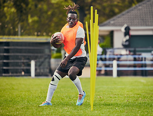 Image showing Rugby, sports and black man training with equipment ready for match, practice and sport games. Fitness, performance and serious male athlete running for warm up, exercise and workout for competition