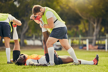 Image showing Rugby sports, men training and stretching outdoor on grass field with team warm up for legs. Athlete group together for fitness, exercise and workout for professional sport with coach and teamwork