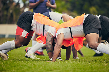 Image showing Rugby, scrum and team of men training on grass field ready for match, practice and sports game. Fitness, performance and male athletes in tackle for warm up, exercise and workout for competition