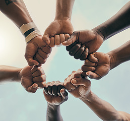 Image showing Hands, fist and unity with a sports team standing in a huddle for solidarity or motivation before a game. Fitness, teamwork and diversity with a group of men in a circle, getting ready for a match