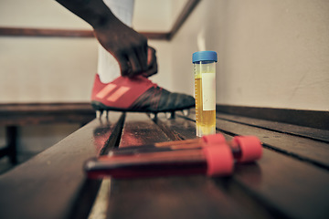 Image showing Rugby, blood and urine sample in a locker room for sports regulations or anti doping testing. Fitness, health and medical with an athlete getting ready after a drug test for an illegal substance