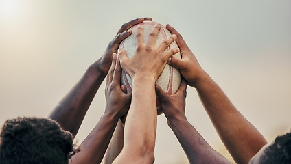 Image showing Diversity, team and hands together in sports on rugby ball for support, motivation or goals outdoors. Hand of sport group unity in fitness, teamwork or success for match preparation or game