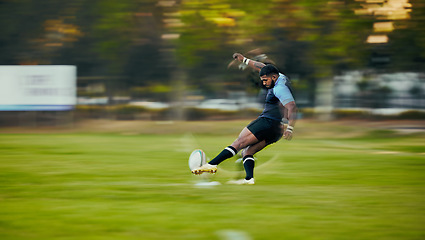 Image showing Rugby, action and black man kicking ball to score goal on field at game, match or practice workout. Sports, fitness and motion, player running to kick at poles on grass with energy and skill in sport