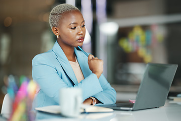 Image showing Laptop, idea and a serious business black woman in her office on a review, proposal or project. Work, focus and thinking with a female employee reading an email or doing research while working