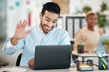 Image showing Asian man, laptop and waving on video call for meeting, introduction or webinar at office desk. Happy creative designer with smile in communication, networking or talking on computer for startup