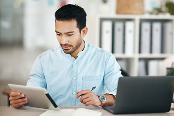 Image showing Creative asian man, tablet and writing schedule for planning, strategy or record keeping by laptop on office desk. Male employee designer working on touchscreen with notebook for startup project plan