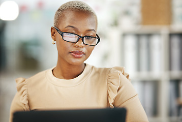 Image showing Office, laptop and black woman with glasses, internet research and checking online report or email. Computer, concentration and serious, African journalist working on article on digital news website