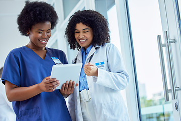 Image showing Tablet, medicine or collaboration with a doctor and nurse talking in the hospital while doing research. healthcare, teamwork and trust with professional medical colleagues working in a clinic