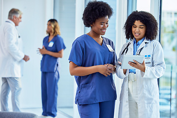 Image showing Tablet, medical or collaboration with a doctor and nurse talking in the hospital while doing research. Healthcare, teamwork and trust with professional colleagues in medicine working in a clinic