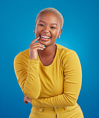 Image showing Portrait, happy and black woman in studio smile, cheerful and laughing on mockup, space or blue background. Face, joy and female laugh, joke and silly humor, carefree and having fun while isolated