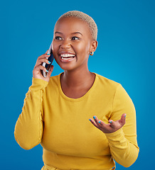 Image showing Phone call, excited and black woman talking in studio for social network, connection and conversation. Communication mockup, smartphone and surprised girl speaking, smile and chat on blue background