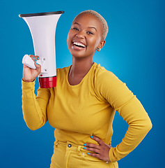 Image showing Black woman, megaphone and happy, protest and voice, freedom of speech and activism on blue background. Female smile, broadcast and speak out, rally and portrait, loudspeaker with opinion in studio