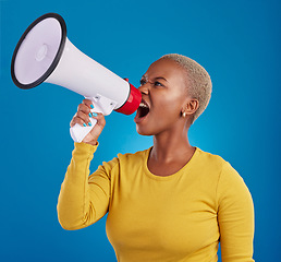 Image showing Megaphone, shouting and angry black woman in studio for message, broadcast or vote on blue background. Speaker, microphone and girl protest for change, democracy and justice, noise and womens rights