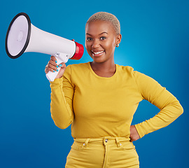 Image showing Black woman, megaphone and smile, portrait and voice, freedom of speech and activism on blue background. Happy female, broadcast and speak out, rally and protest, loudspeaker with opinion in studio