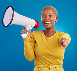 Image showing Black woman, megaphone and pointing, protest and voice, freedom of speech and activism on blue background. Happy female, broadcast and speak out, rally and portrait, loudspeaker and opinion in studio