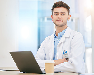 Image showing Laptop, doctor and portrait of man in hospital at desk for internet, telehealth app and medical research. Healthcare, insurance and serious health worker in clinic for consulting, medicine and online