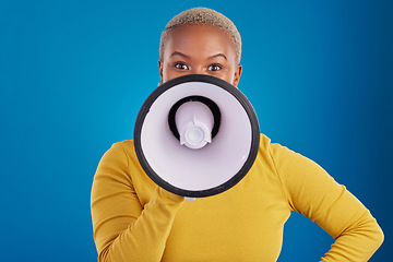 Image showing Megaphone, change and speaker with black woman in studio for awareness, democracy and opinion. Vote, announcement and message with female on blue background for empowerment, strike and choice