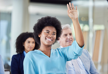 Image showing Black woman, presentation and question in business, answer or FAQ in team meeting from audience in seminar. African female with hands raised in staff training, planning or strategy in crowd workshop