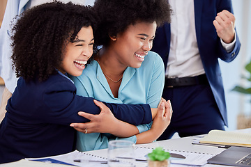 Image showing Business woman, friends and hugging in congratulations for promotion, sale or bonus at the office desk. Women hug in celebration for corporate success, teamwork or support for winning or achievement