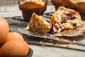 Image showing Muffins with red fruits jam fill.