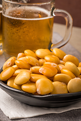 Image showing Tasty lupins and glass of beer