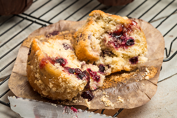 Image showing Muffins with red fruits jam fill.