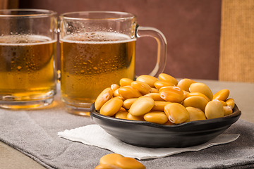 Image showing Tasty lupins and glass of beer